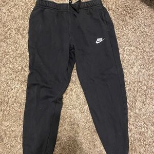 Black Nike sweats.